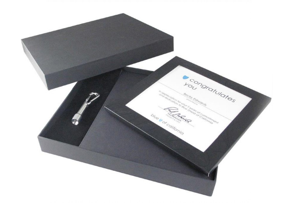 Deluxe presentation box holding a certificate and gift booklet